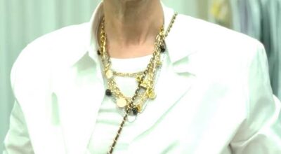 Celine Dion canta bajo la lluvia con un elegante vestido de flecos en la ceremonia inaugural de los Juegos Olímpicos